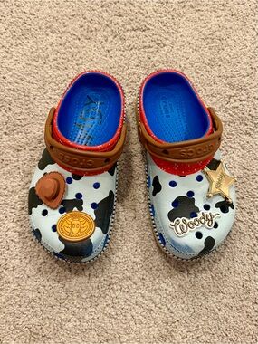 CROCS Kids Woody Clog - White Black Cow Print with Blue, Red & Brown Accents